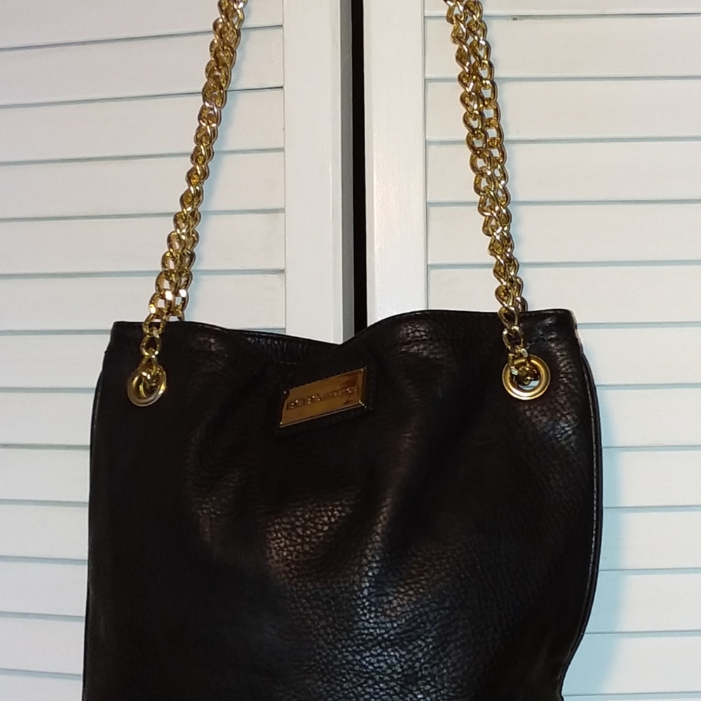 BCBG black & gold purse with gold chain straps. Gently used